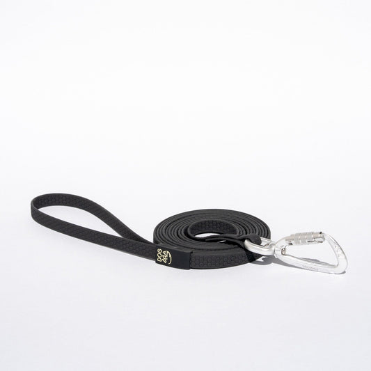 Black dog leash with a silver clip on a white background