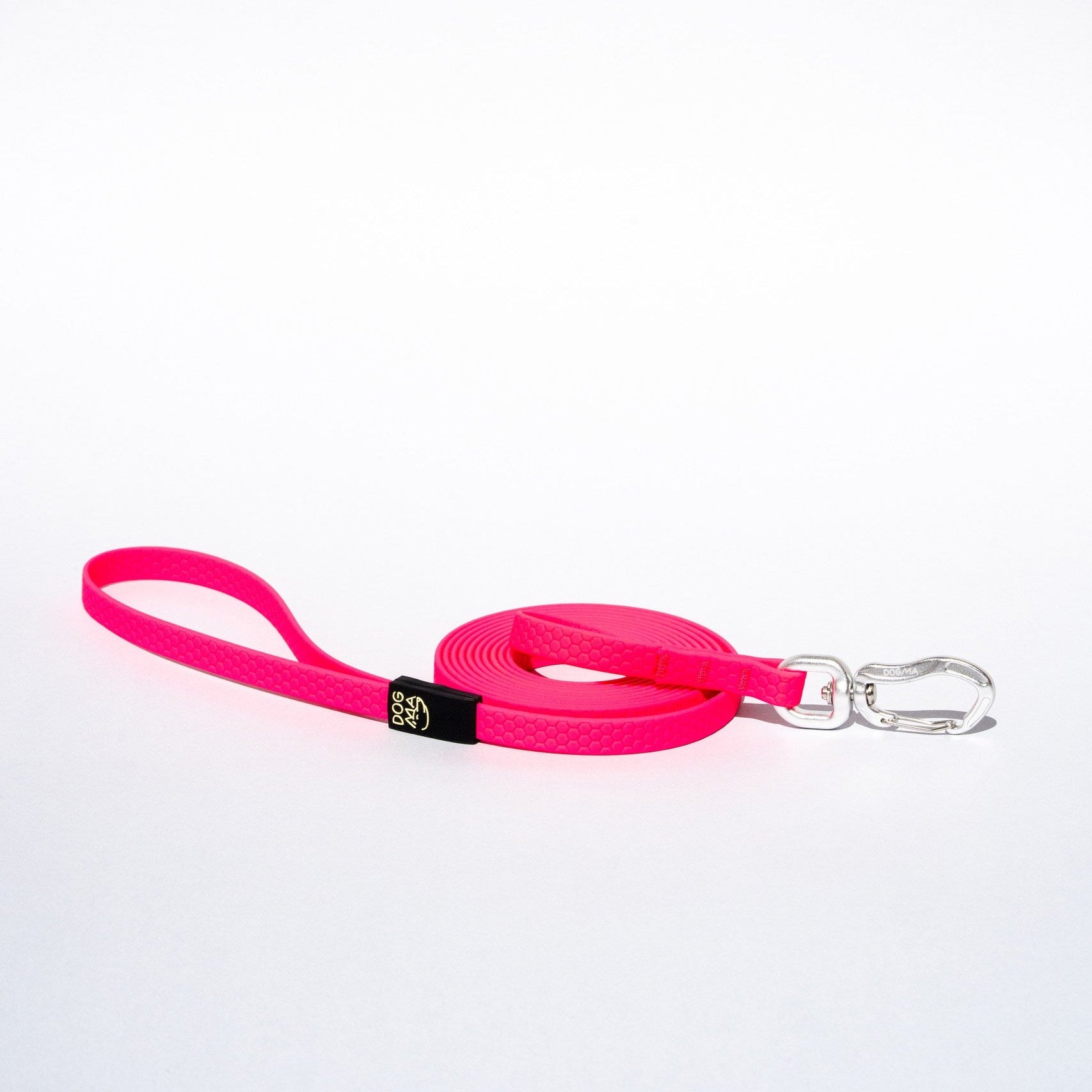 Pink dog leash with a clip on a white background