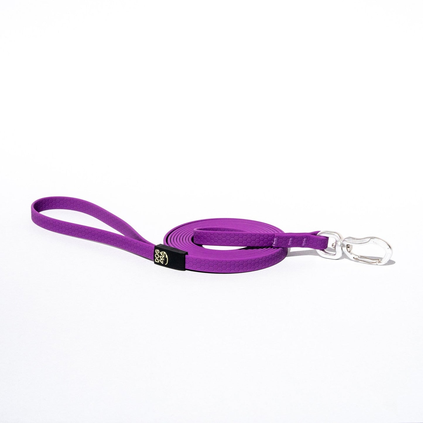 Purple dog leash with a black clip on a white background