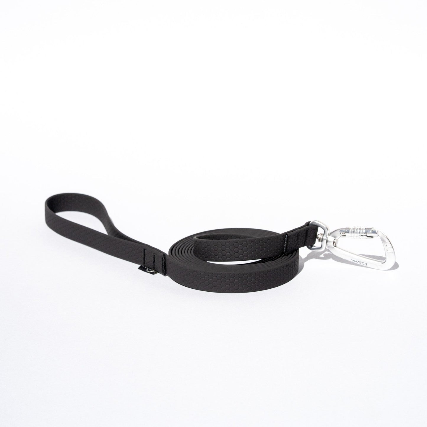 Black dog leash with a clip on a white background