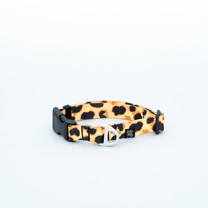 Leopard print dog collar with black buckle on a white background